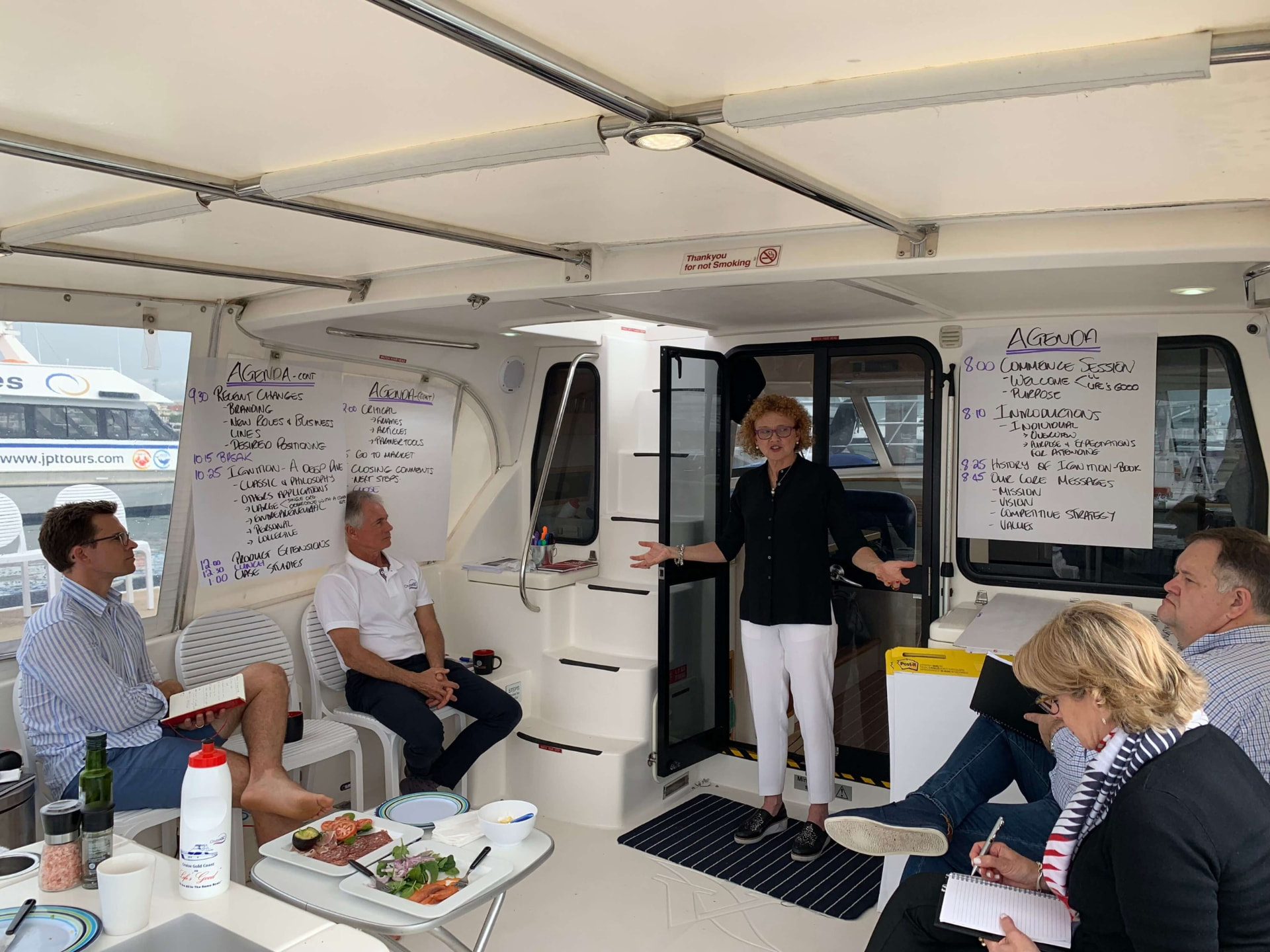 Dr. Kathryn Ritchie facilitating a strategy session on a boat